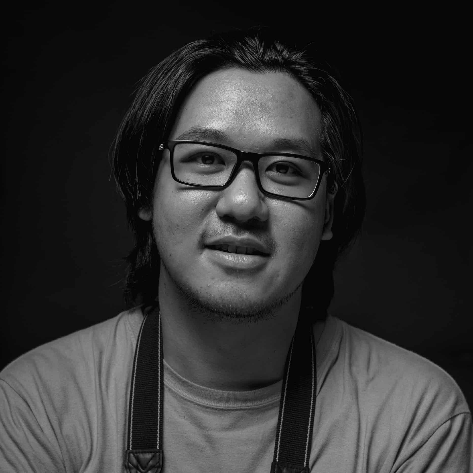 black and white photo of a man in glasses