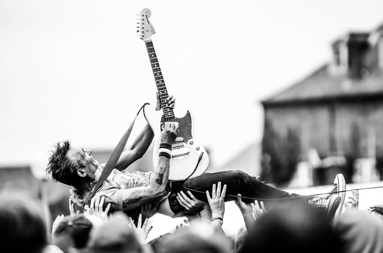 guitarist riding crowd