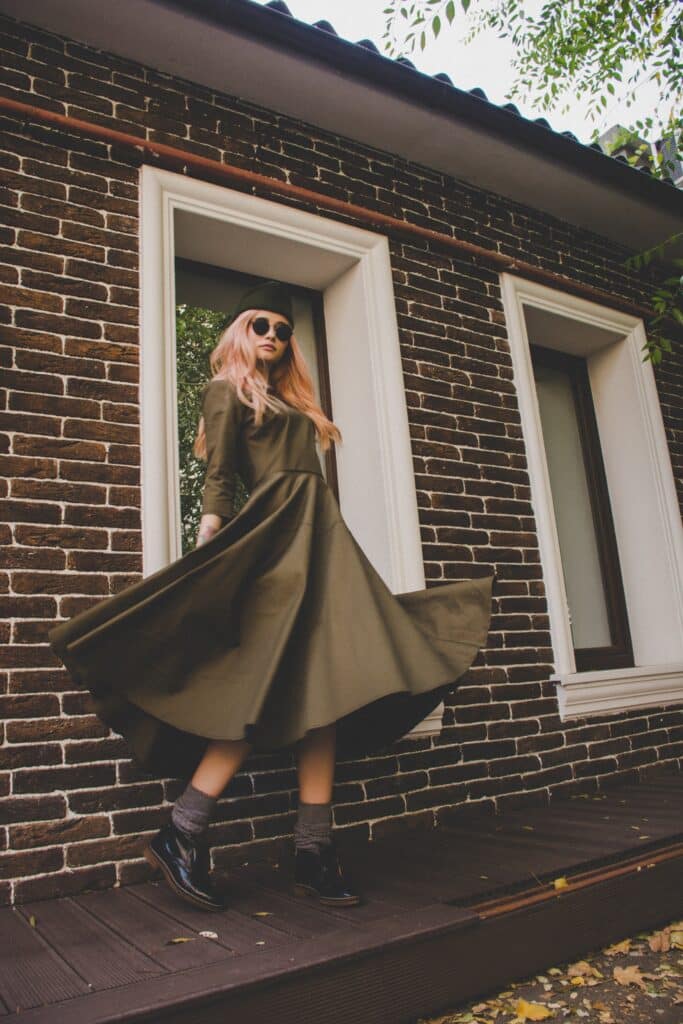 woman twirling in full-skirted vintage coat