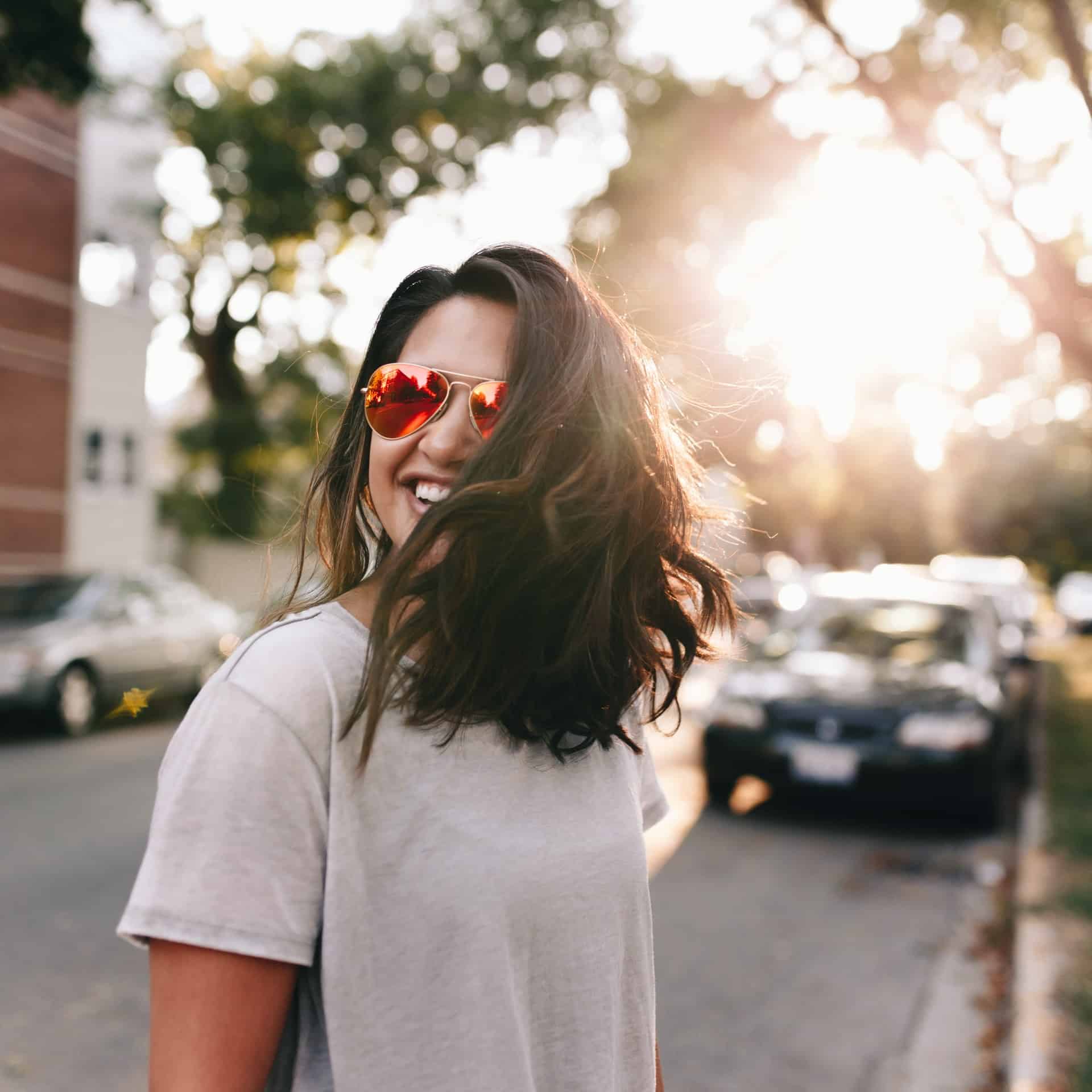 woman in white tshirt under the sun